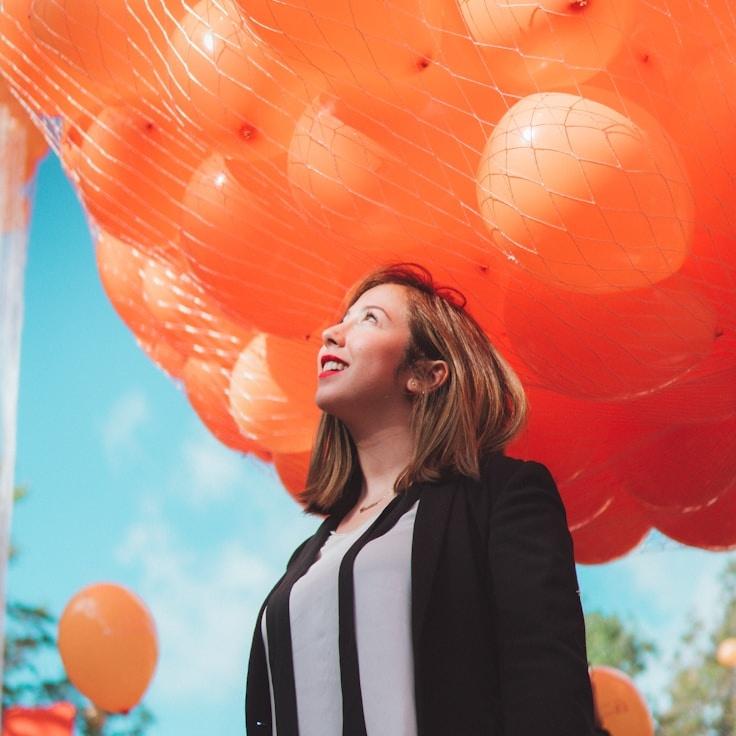 Kaveri Mehta, Lead Design Curator at BeeMintBox, reviewing corporate floral arrangements